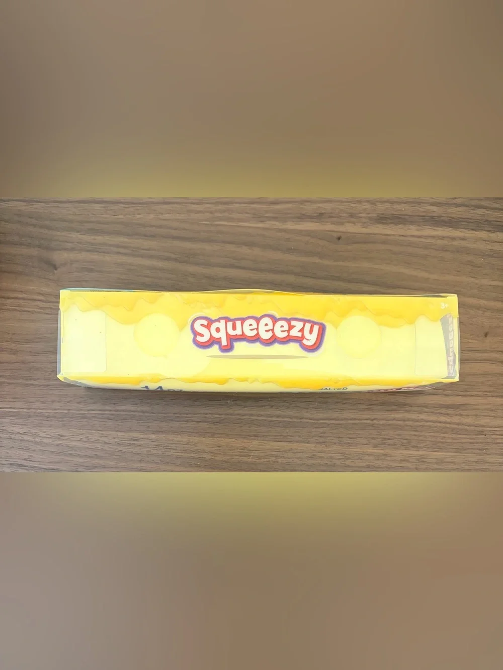 Fun oversized Squeezy squishy toy designed to look like a 14 oz stick of salted